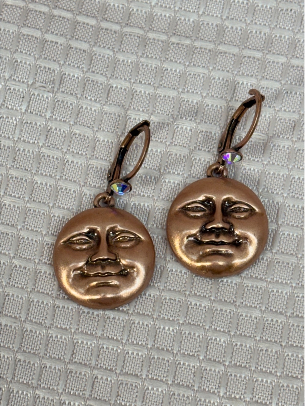 Kirks Folly earrings Man in the Moon motif copper-toned finish leverback